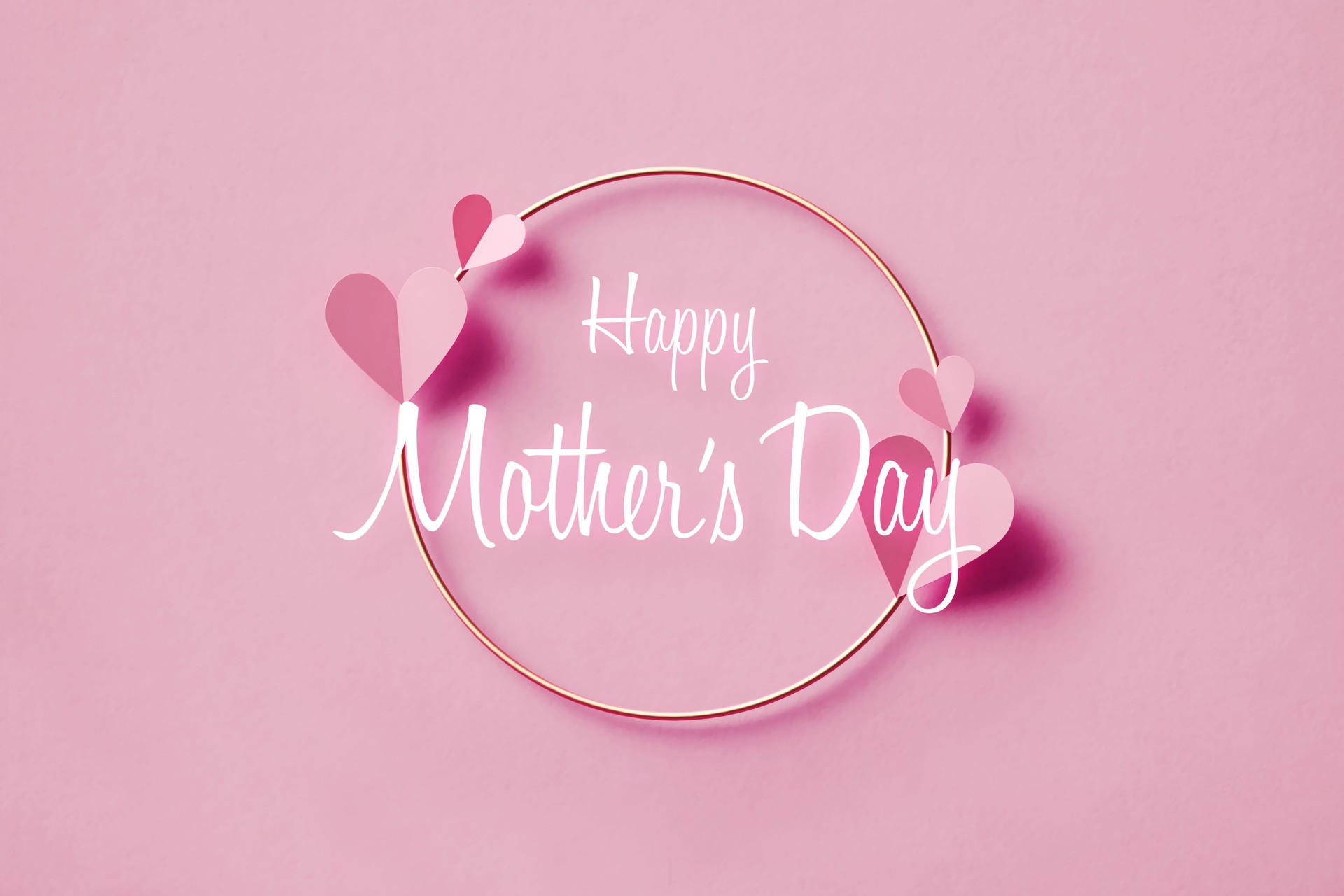 Happy Mother's Day Message Over Pink Heart Shapes And Gold Colored Circle On Pink Background